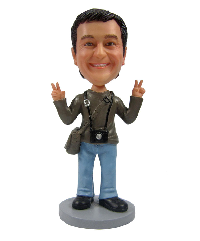 A male with camera and bag bobbleheads 2111