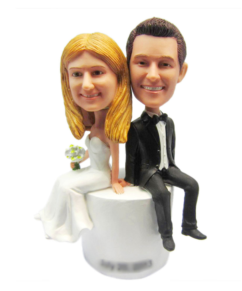 Bride and Groom Sit on Base Wedding bobblehead