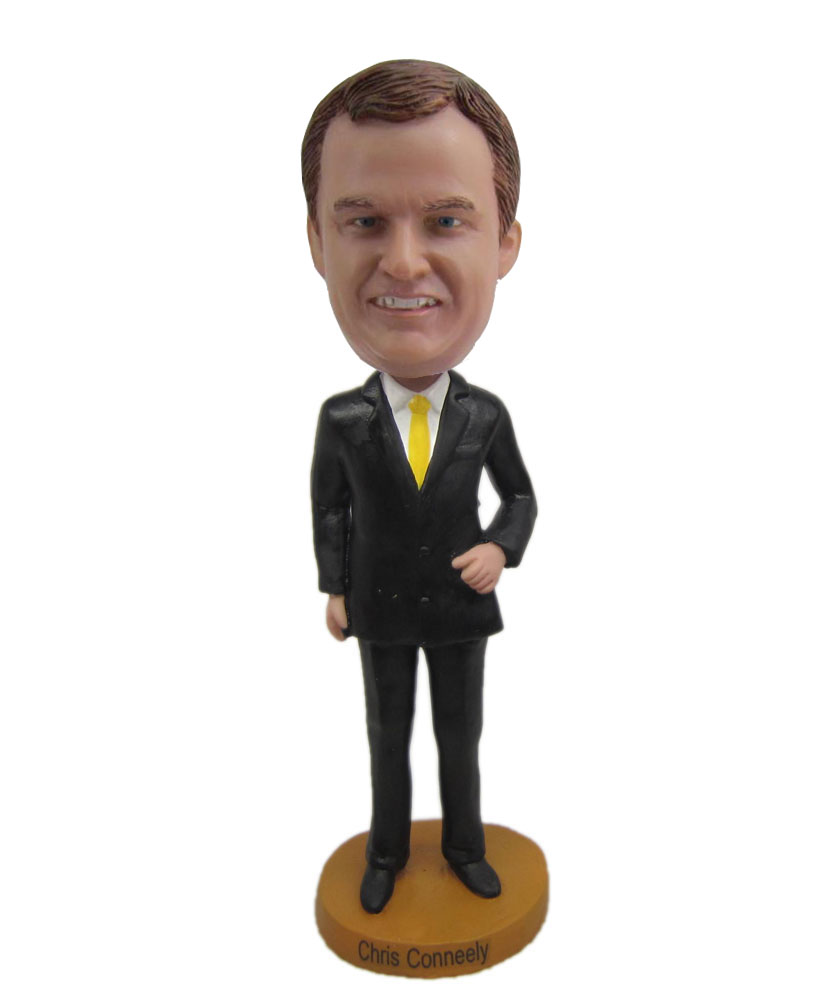 Popular bobbleheads dressed in black suit and yellow tie