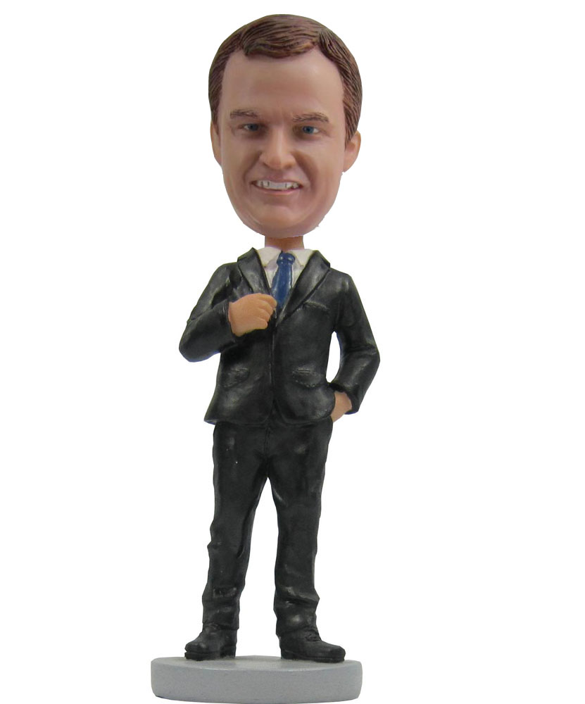 Collectible bobbleheads dressed in black suit