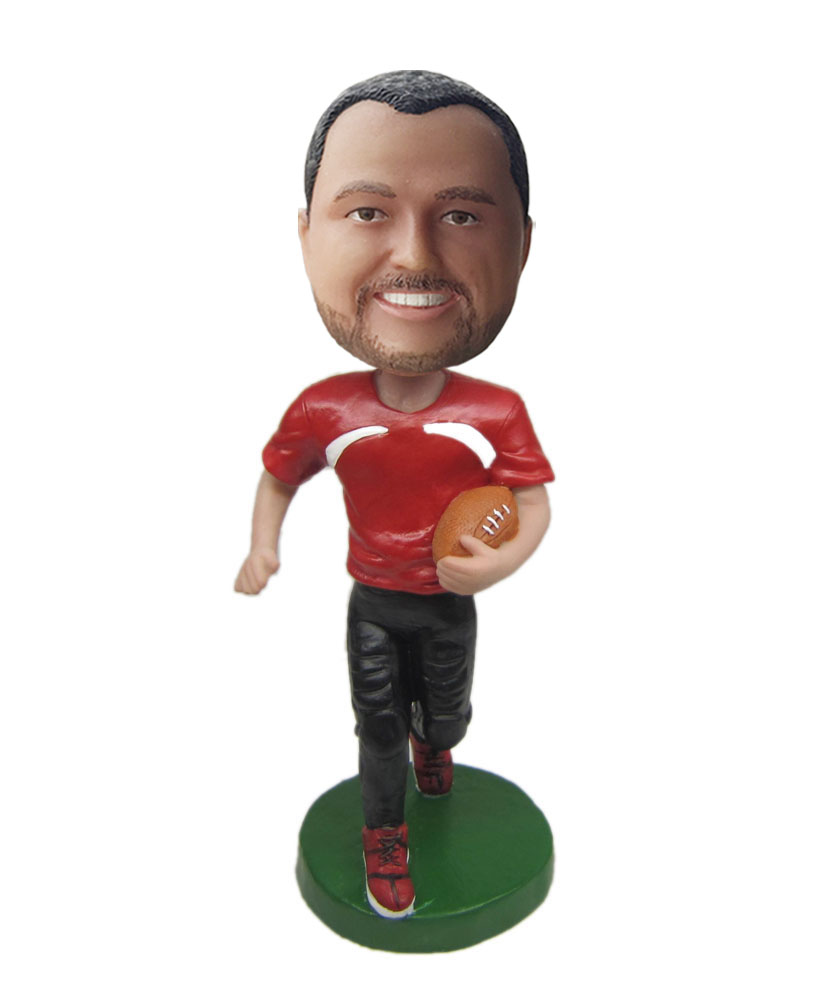 Custom made bobble head of rugby player