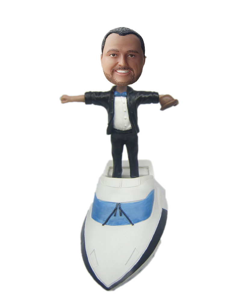 bobble head figures standing on a white yacht G206