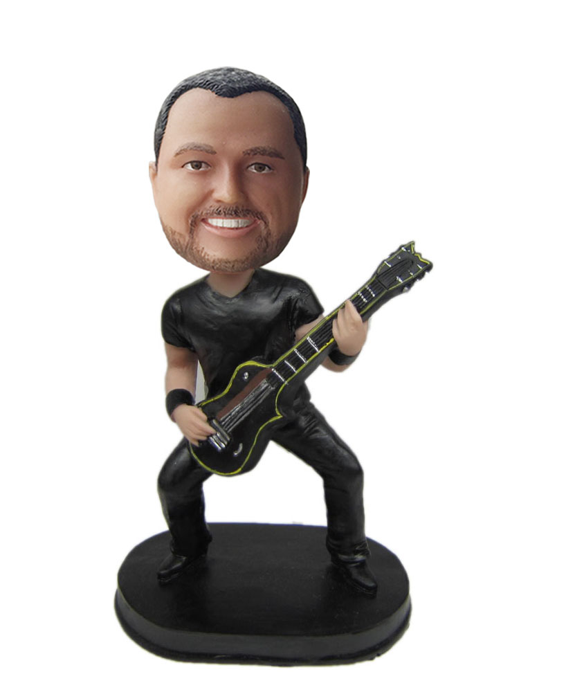 funny dashboard bobbleheads of guitar player