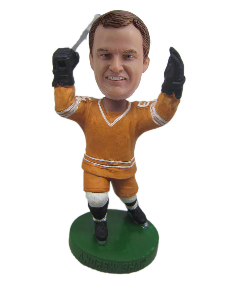 Hockey player with yellow man bobble doll