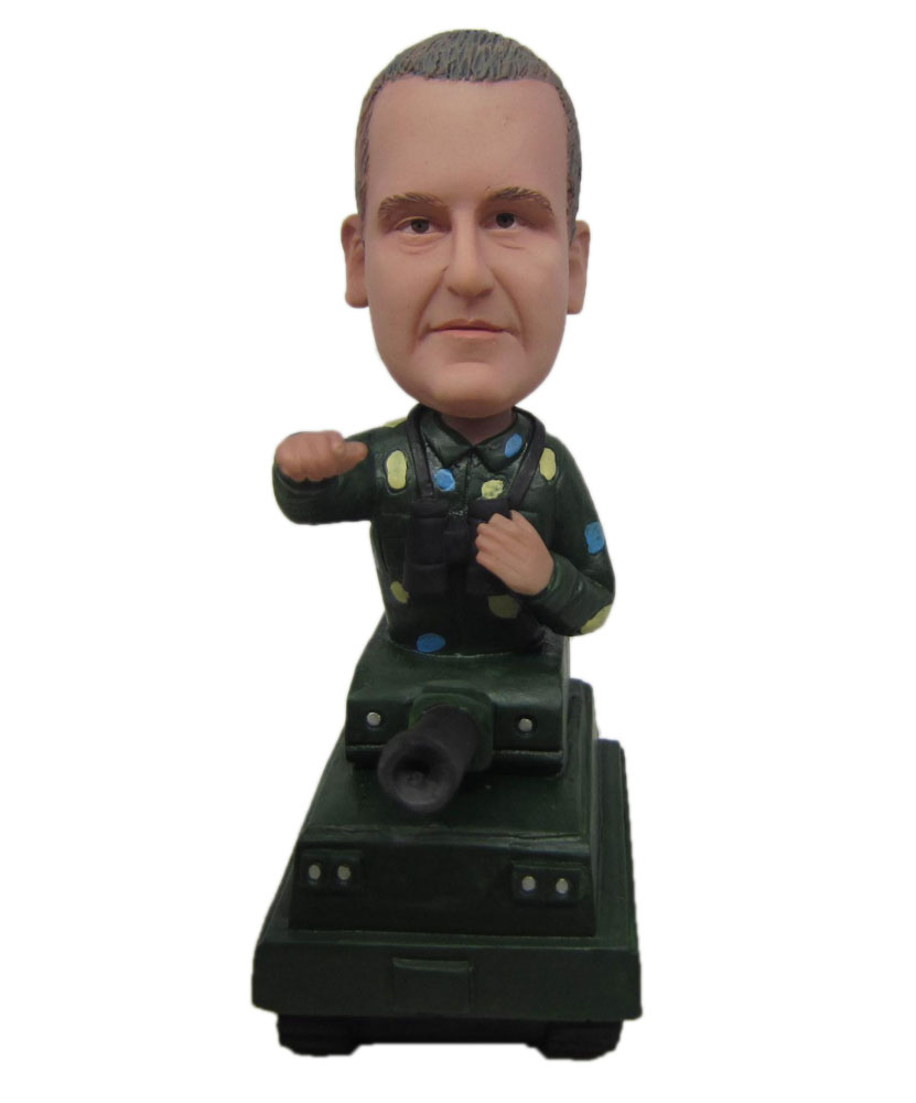 Commander bobble Head standing on a tank