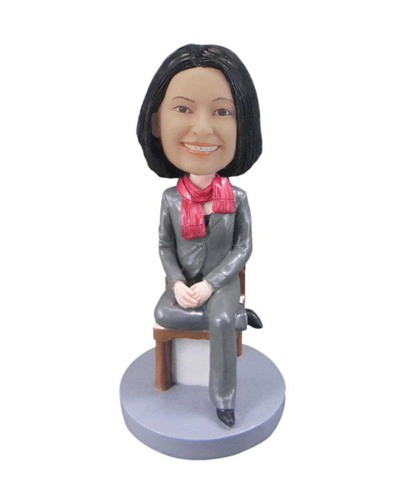 Custom bobblehead female wearing Gray suit sitting in chair F103