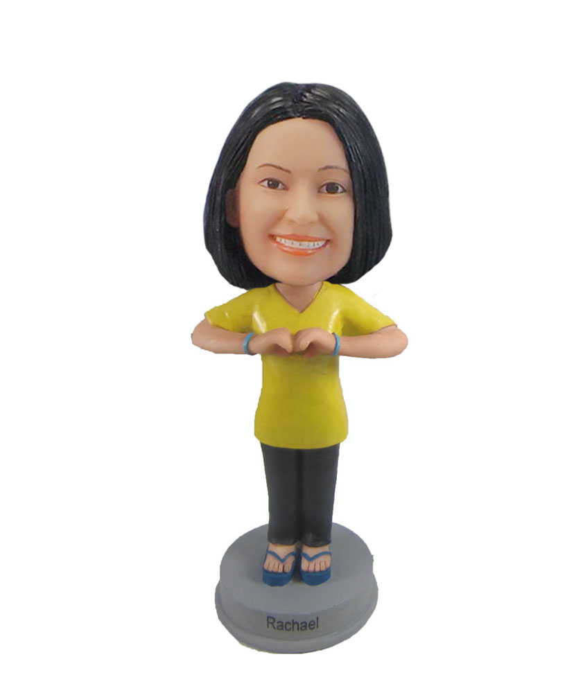 Female in yellow T-shirt bobblehead shaking head doll F1045